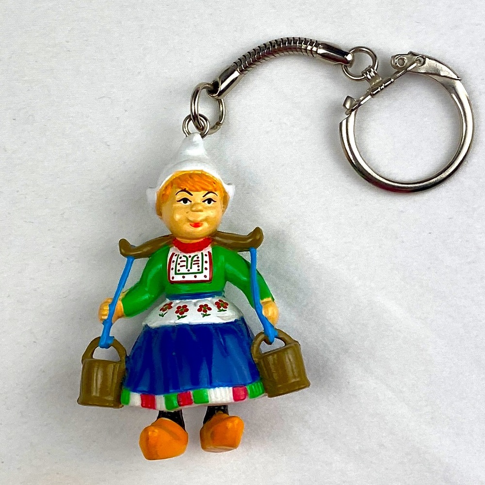 Dutch woman carrying milk pales wearing wooden shoes keychain